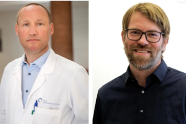 En mann med skjegg og briller